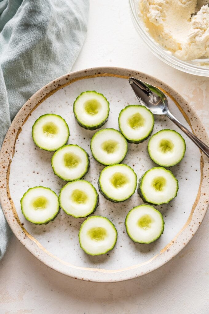 Thin slices of cucumber with the seeds scooped out.