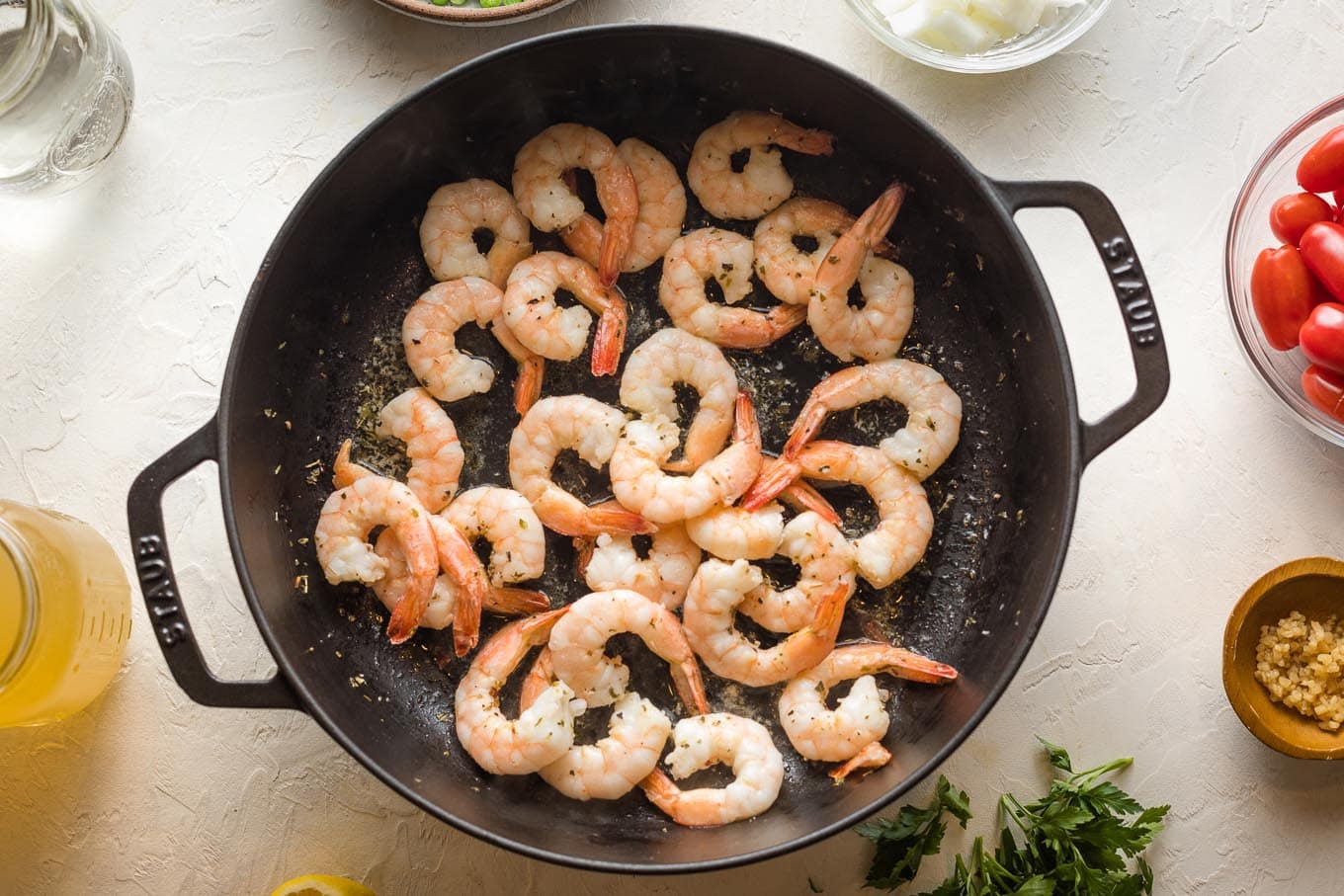 Cooked shrimp in a skillet.