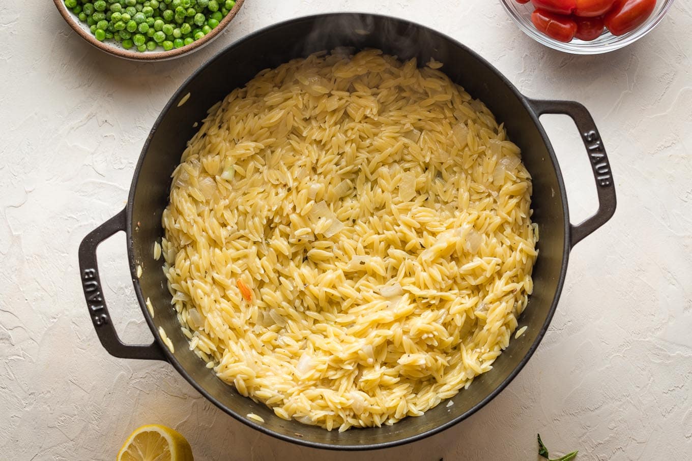 Cooked orzo in skillet.
