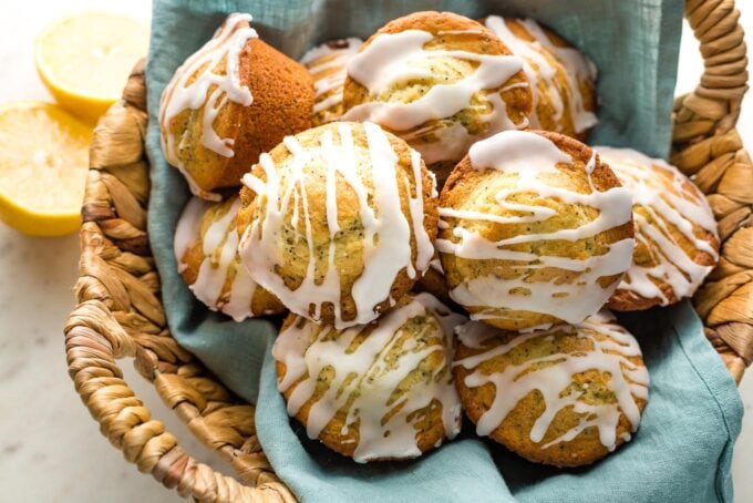 Lemon poppy seed muffins in a basket.