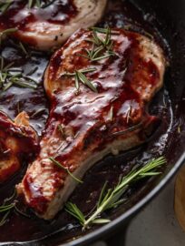 Balsamic Plum Pork Chops are deliciously seasoned, pan-seared, and nestled in a simple sauce of fresh plums, balsamic vinegar, a hint of brown sugar, and woodsy rosemary. We love a restaurant-worthy meal with just a few ingredients, and this one feels elegant yet is easy to make at home!
