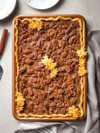 A brown butter slab pecan pie in a pan, baked and ready to serve.