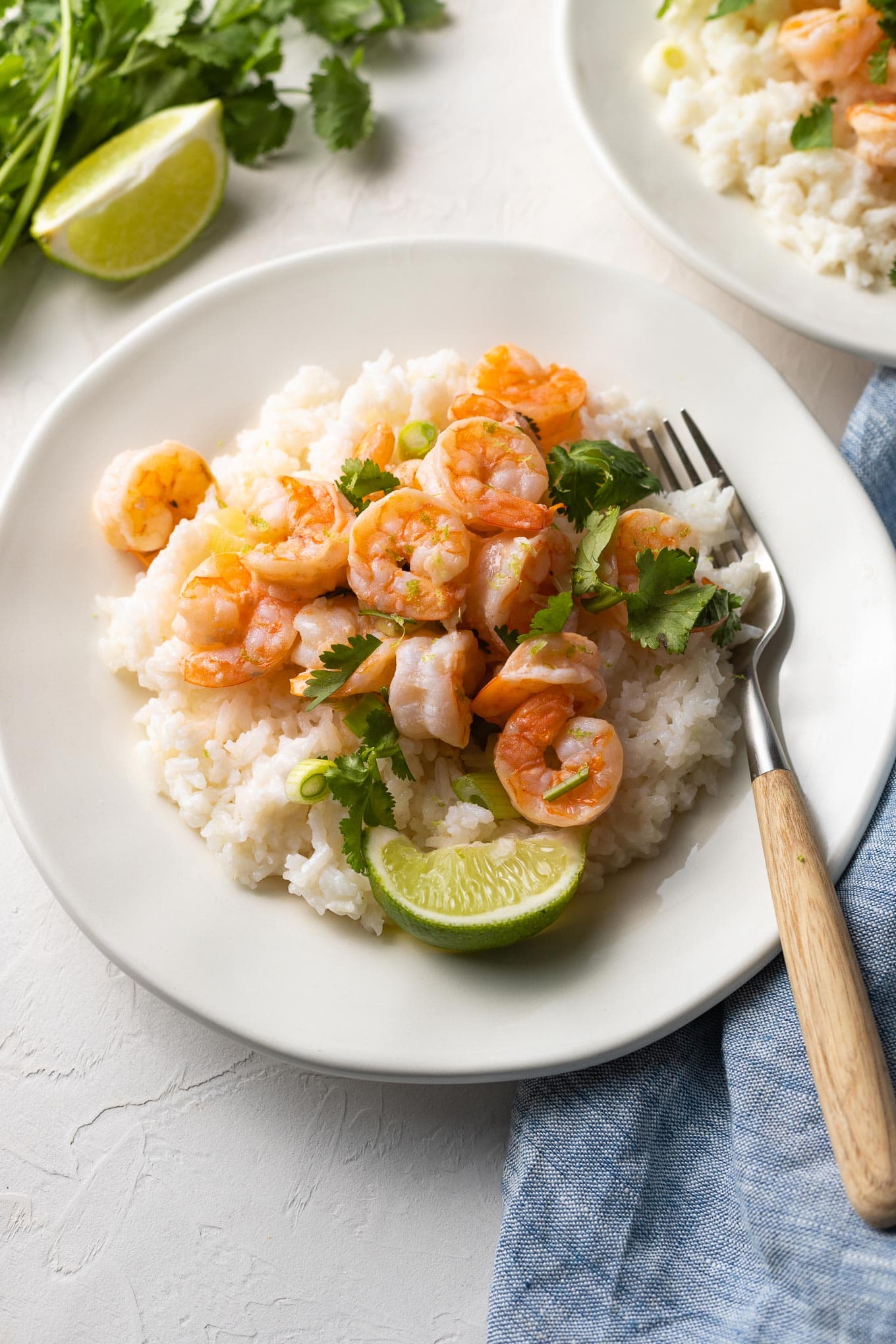 Plate of garlic lime shrimp with coconut rice, ready to eat.