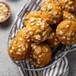 Pumpkin muffins stacked in a basket, ready to share.