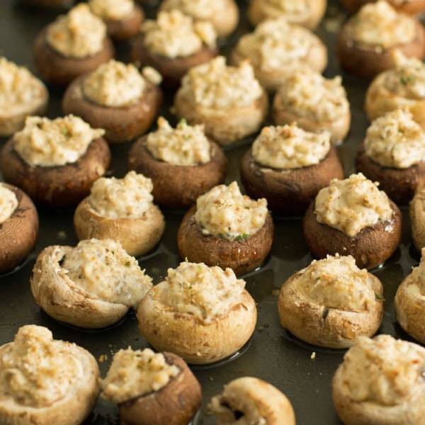 Baking sheet full of stuffed mushrooms just pulled from the oven.