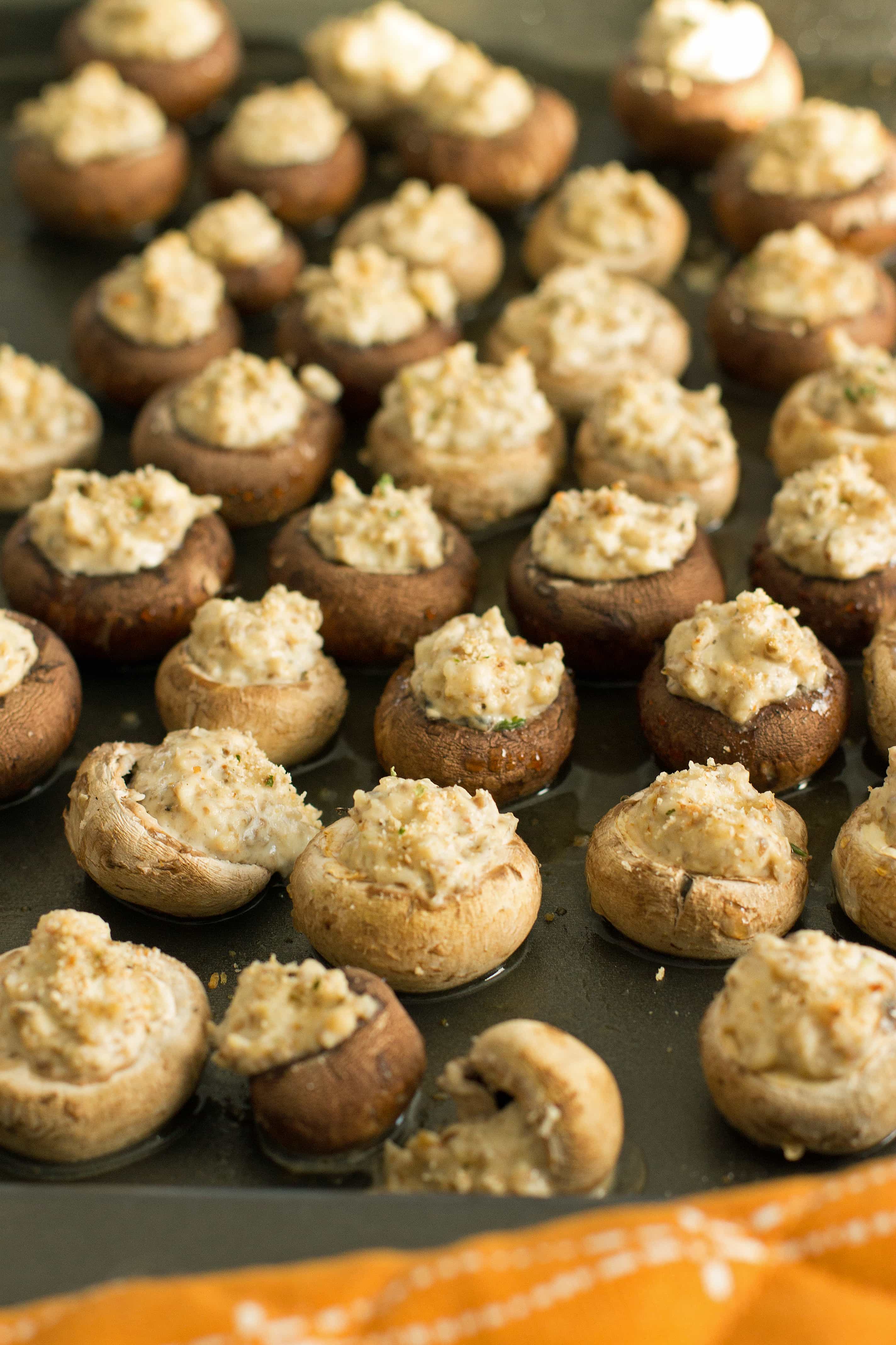 Baking sheet full of stuffed mushrooms just pulled from the oven.