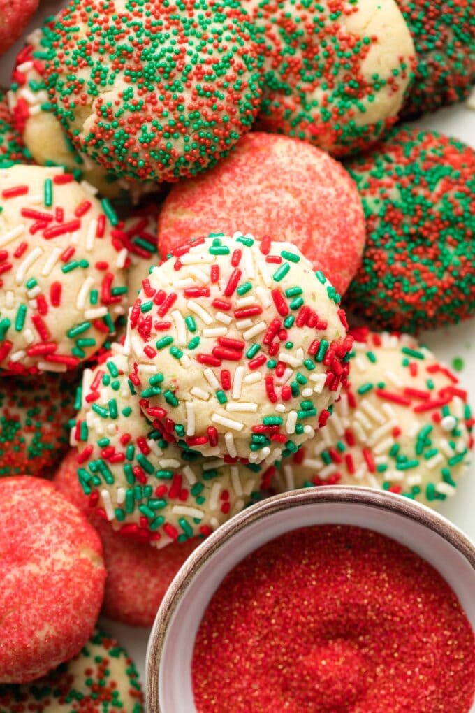 Close-up of a drop sugar cookie with red and green jimmies.