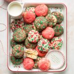 Tray holding sprinkle sugar cookies set out with milk for Santa.