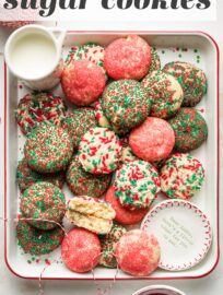 These no-roll, no-cut sugar cookies have a smidge of cream cheese to guarantee a smooth, light texture and are coated in beautiful red and green sprinkles for a festive addition to your cookie tray. This recipe is fun and foolproof!