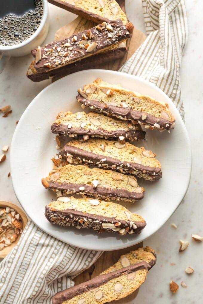 Plate full of biscotti served with coffee.