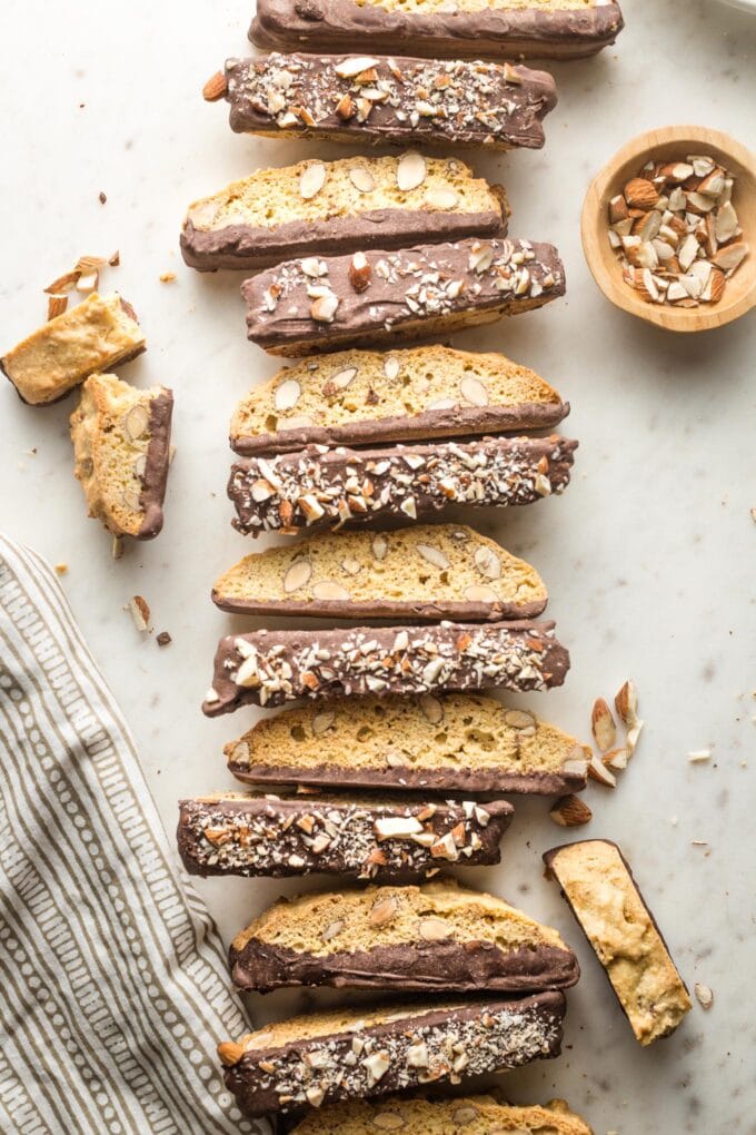 Large row of chocolate-dipped almond biscotti.