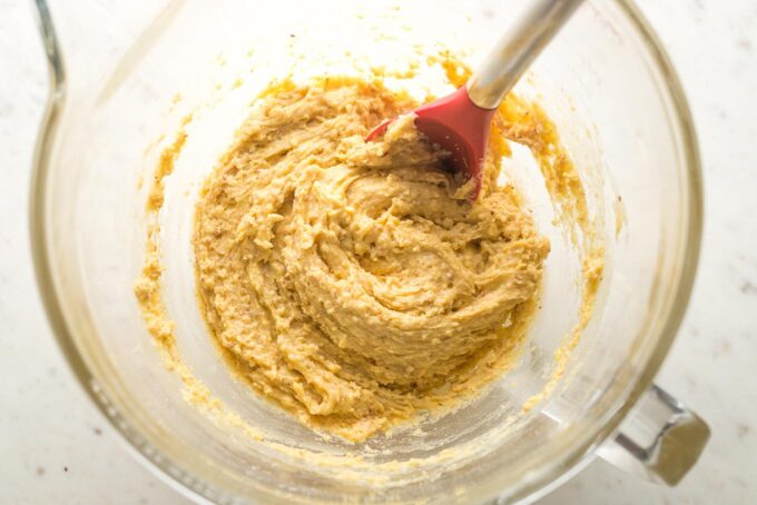 Biscotti dough mixed in the bowl of a stand mixer.