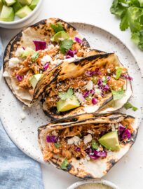 Overhead image of three tacos made with Instant Pot chicken Tinga.