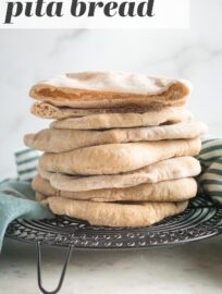 This super simple Whole Wheat Pita Bread blows store-bought versions out of the water! With an unbelievably soft, fluffy texture, a slightly sweet taste, and beautiful pockets, this is the only homemade pita recipe you need.