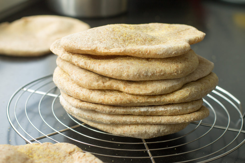 Homemade whole wheat pita bread, soft yet sturdy, with a full pocket just waiting for your falafel, gyro, shwarma, or hummus. Puts store-bought to shame!