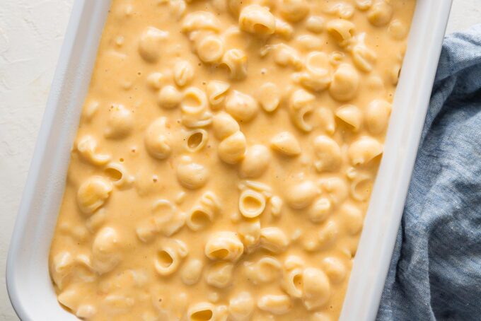 Creamy mac and cheese in a rectangular baking pan.