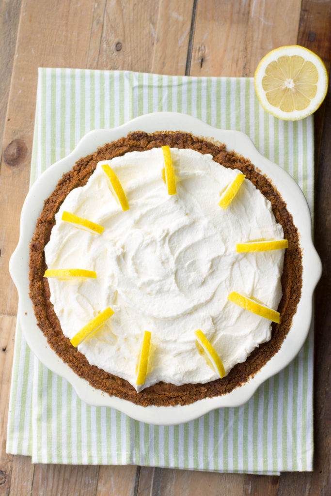 Overhead view of a lemon cream pie with whipped cream topping.