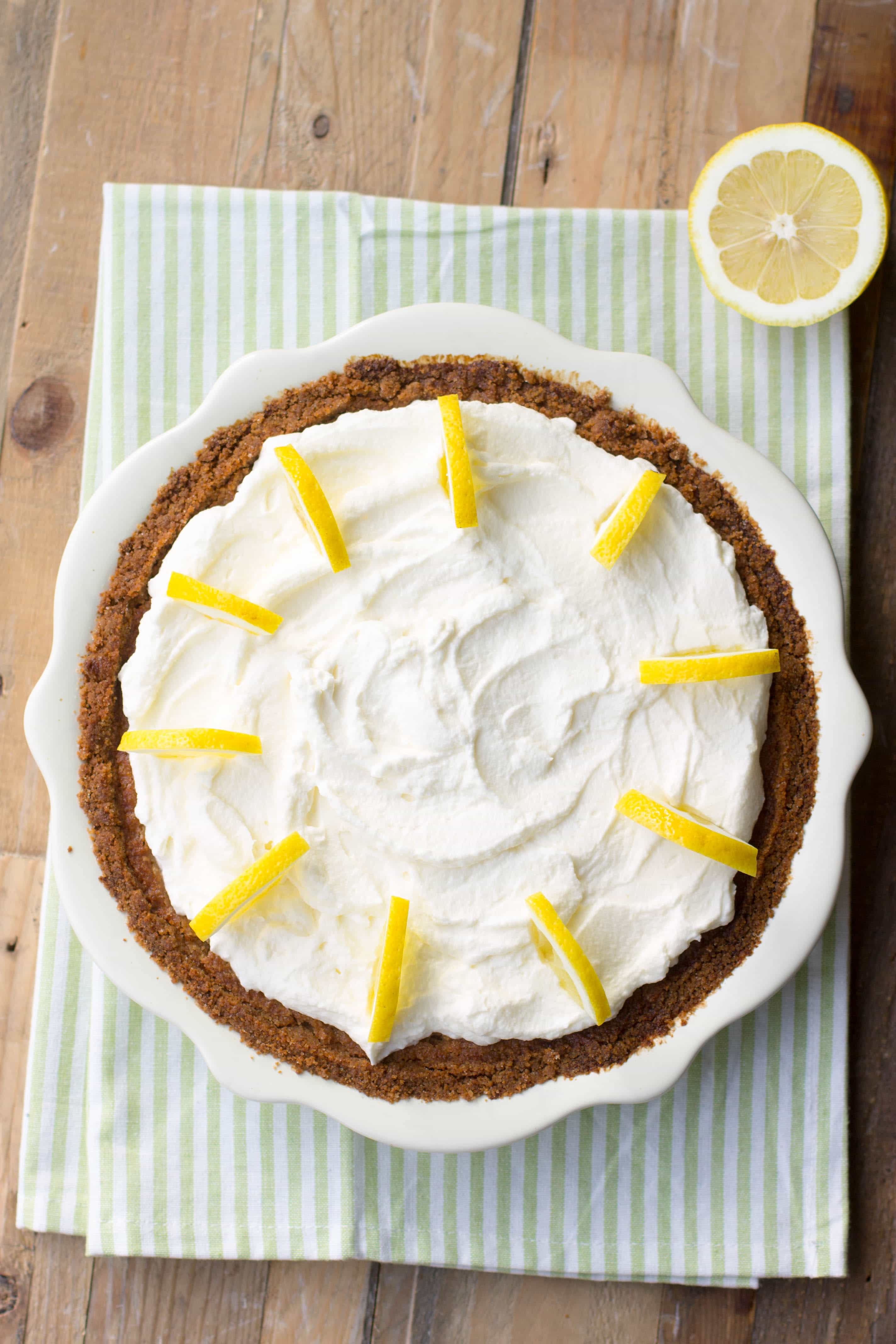 Overhead view of a lemon cream pie with whipped cream topping.