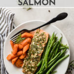 Make dinner simple and delicious! This healthy baked salmon recipe is easy to make in the oven with one pan and 30 minutes. It's also kid-friendly, with amazing rosemary and garlic flavor, carrots, and green beans. Learn the easy one-two roasting trick that gets this meal on the table quickly and using just one sheet pan. #salmon #healthy #baked #oven