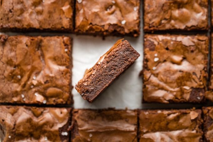 Cut brownies with one turned to show the fudgy, chewy interior.