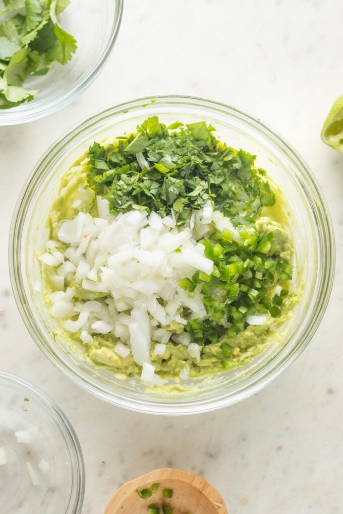 Onion, jalapeño, cilantro, lime juice, and salt ready to mix in.