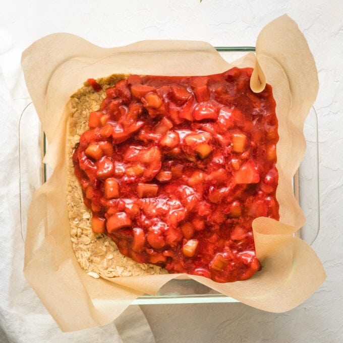 Fruit filling spread in square glass baking pan.