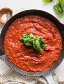 A simple homemade marinara sauce just cooked with fresh basil in the skillet.