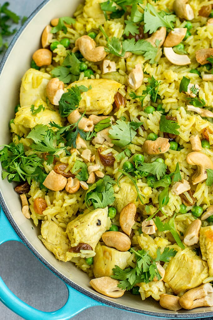Easy spiced cashew chicken and rice - a quick, delicious one-pot weeknight dinner with curry, cilantro, and fresh ginger.