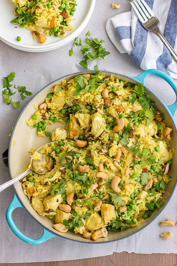 Easy spiced cashew chicken and rice - a quick, delicious one-pot weeknight dinner with curry, cilantro, and fresh ginger.