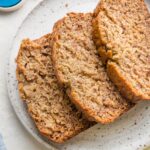 Small plate with three stacked slices of banana bread.