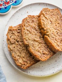 Small plate with three stacked slices of banana bread.