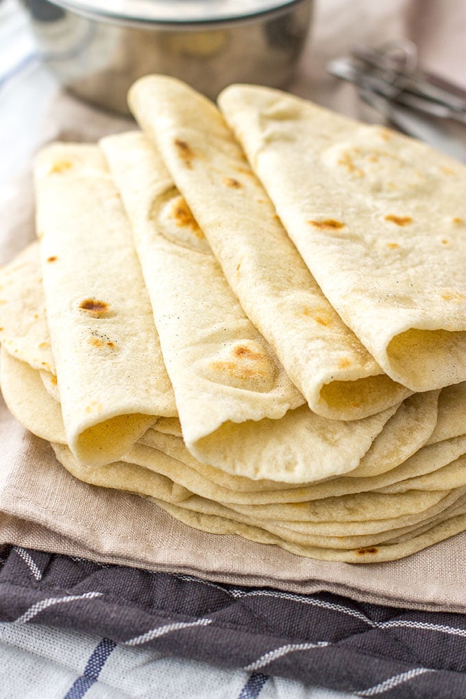 Easy flour tortillas from scratch | Take tacos, enchiladas, burritos, and more to the next level with easy, homemade flour tortillas, made from scratch with just 5 simple ingredients.