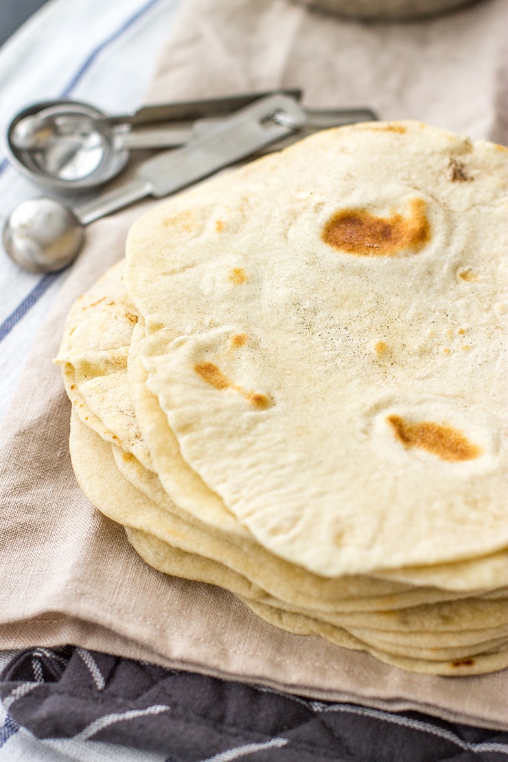 A stack of flour tortillas made from scratch.