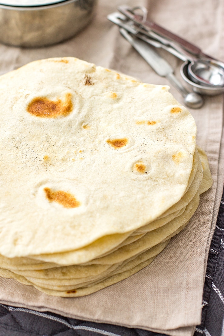 A stack of flour tortillas made from scratch.