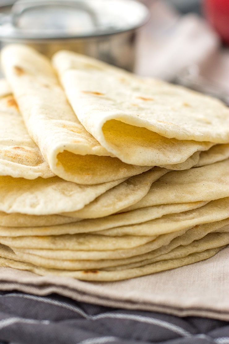 A stack of flour tortillas made from scratch.