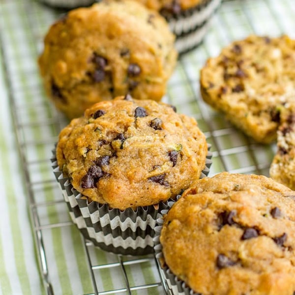 Zucchini chocolate chip muffins made with wholesome ingredients. Perfect for busy mornings, snacks, and encouraging toddlers to eat some green veggies!
