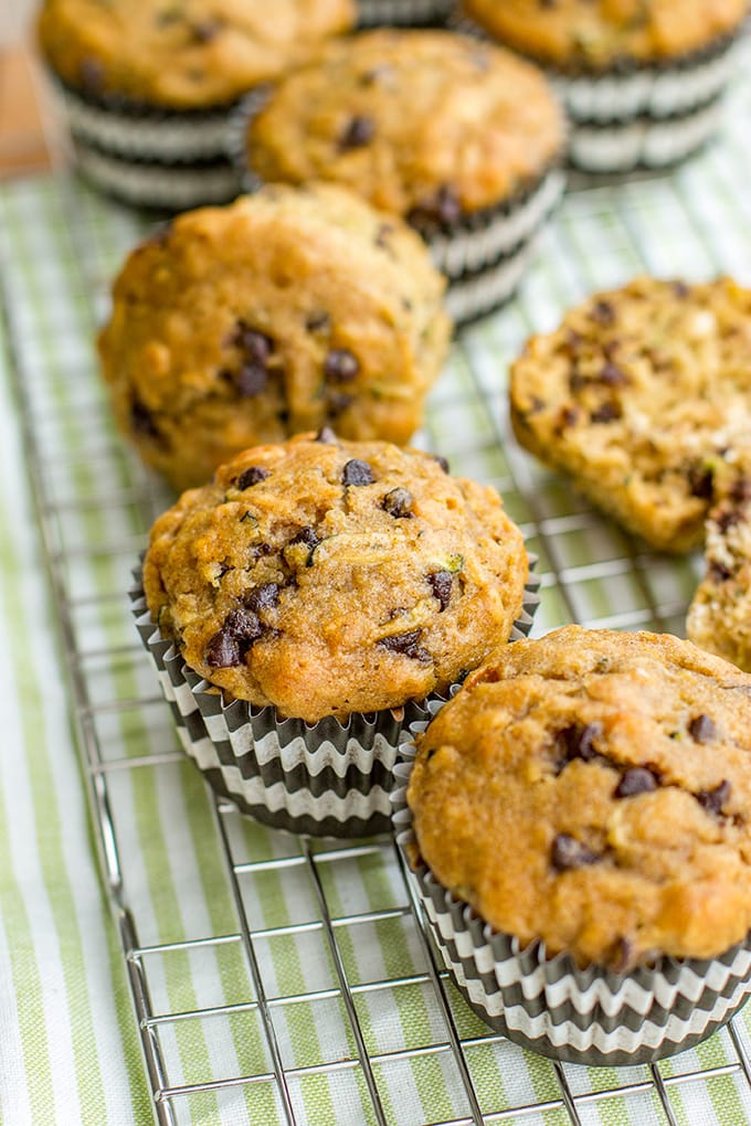 Zucchini chocolate chip muffins made with wholesome ingredients. Perfect for busy mornings, snacks, and encouraging toddlers to eat some green veggies!