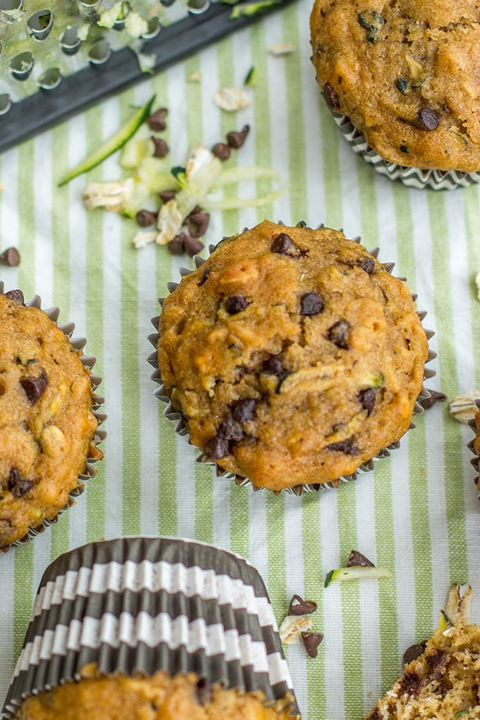 Zucchini chocolate chip muffins made with wholesome ingredients. Perfect for busy mornings, snacks, and encouraging toddlers to eat some green veggies!