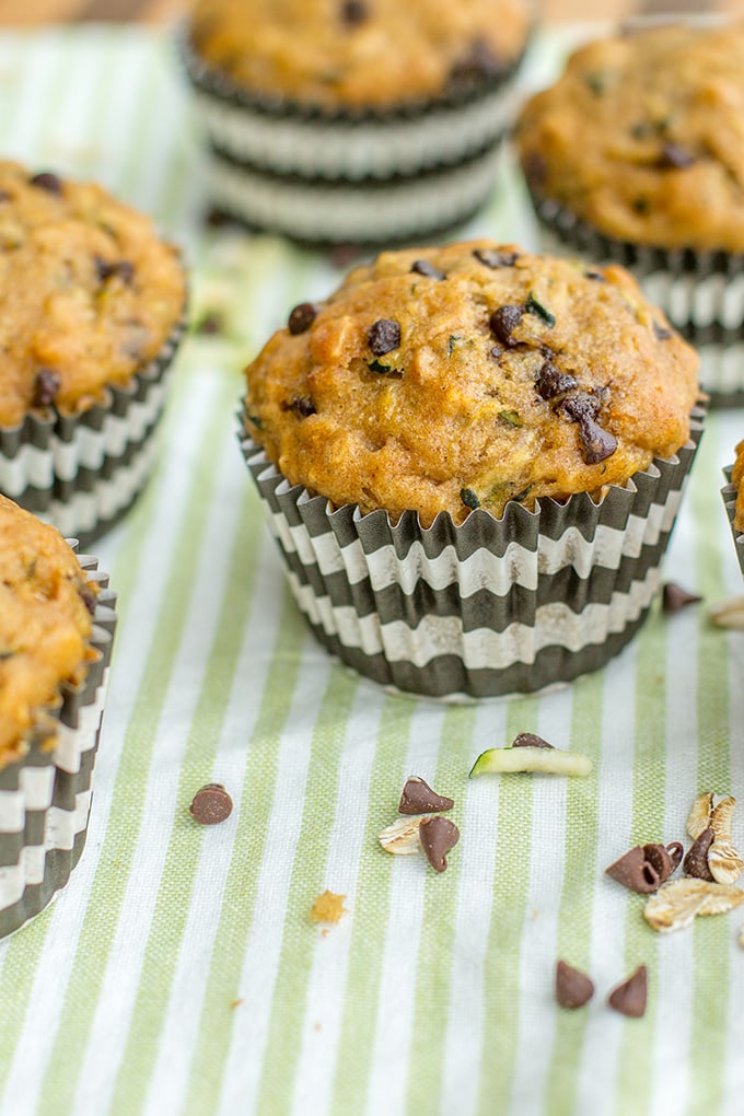 Zucchini chocolate chip muffins made with wholesome ingredients. Perfect for busy mornings, snacks, and encouraging toddlers to eat some green veggies!