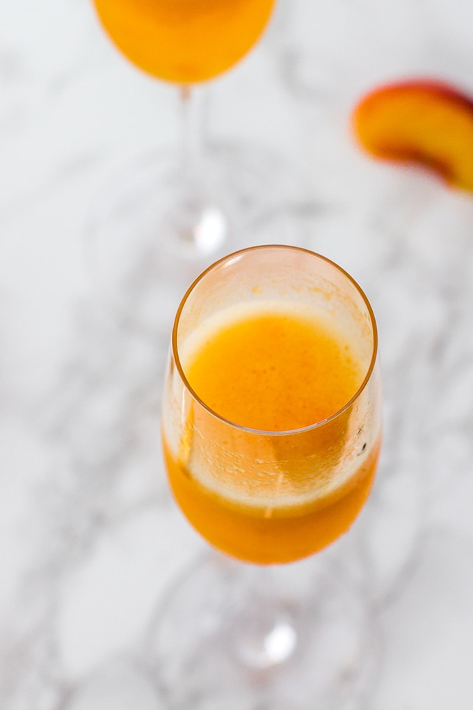 Classic peach bellini | The essential sparkling cocktail with champagne or prosecco and lightly-sweetened peach puree.