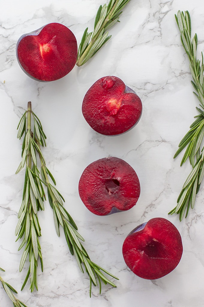 Rosemary plum bellini | A festive, fruit spin on the classic sparkling cocktail with champagne or prosecco. A perfect late summer or holiday drink!
