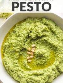 A simple recipe transforms excess zucchini into a healthy zucchini basil pesto with spinach, Parmesan, garlic, and pine nuts. Mix with pasta, add to chicken, or use anywhere you love regular pesto!