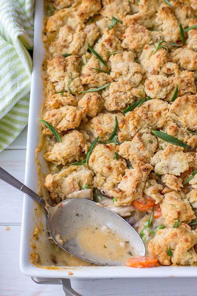 Savory parmesan biscuit crumble chicken pot pie | Ultimate comfort food, chicken pot pie with carrots, celery, mushrooms, a creamy roux, and a simple biscuit topping. #chickenpotpie #comfortfood