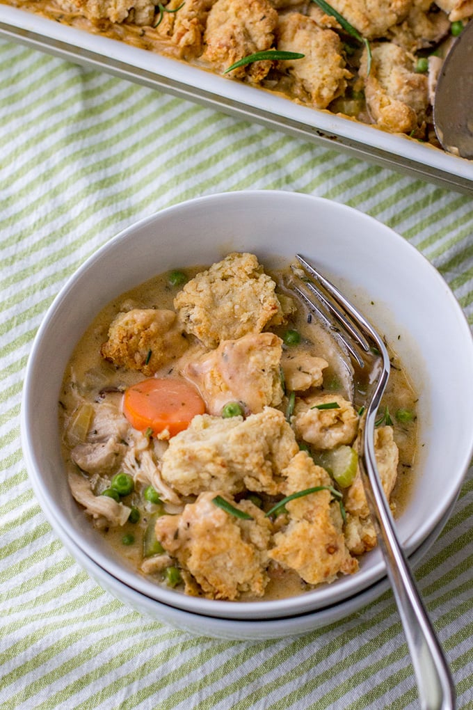 Savory parmesan biscuit crumble chicken pot pie | Ultimate comfort food, chicken pot pie with carrots, celery, mushrooms, a creamy roux, and a simple biscuit topping. #chickenpotpie #comfortfood