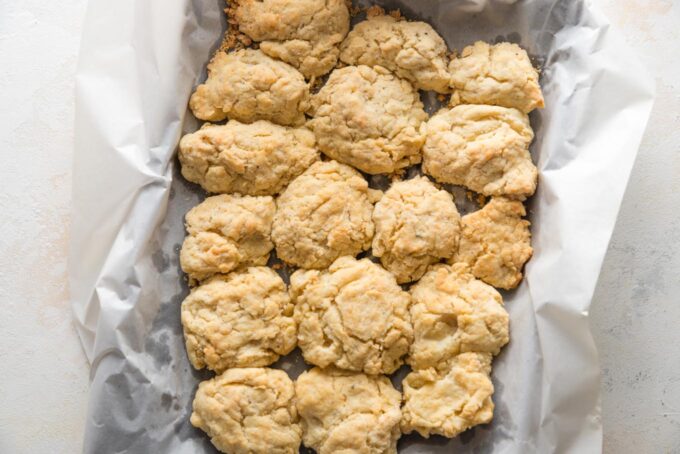 Rustic Parmesan biscuits baked on a sheet pan.