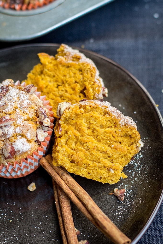 Pumpkin pecan streusel muffins | Sweet, moist pumpkin muffins topped with a cinnamon sugar pecan streusel. Delicious for fall and Thanksgiving brunch! #pumpkin #fallbaking
