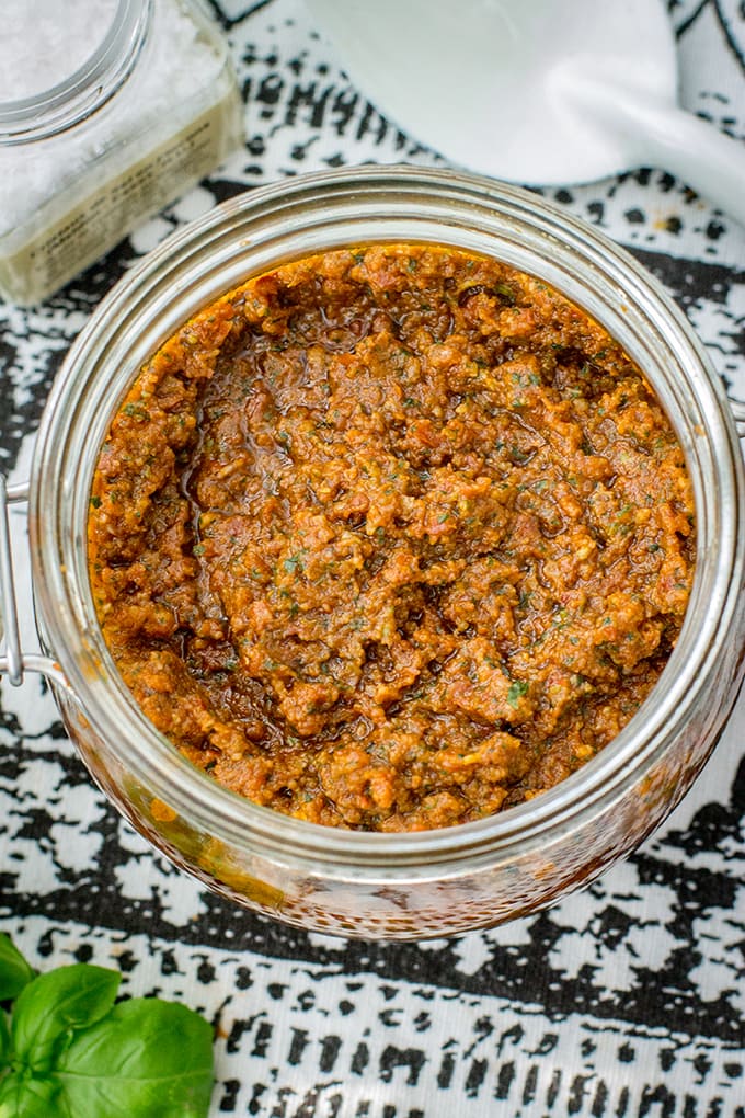 Homemade sun-dried tomato pesto | Quick and easy pesto recipe with tomatoes, basil, pine nuts, and parmesan. Just a spoonful adds instant flavor to sauces, soups, pizza, pasta, and more! #pesto #fromscratch