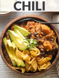 Full of flavor and so simple to make, this sweet potato black bean chili is a delightfully satisfying meatless meal. Vegetarian and vegan friendly! Tender sweet potatoes, hearty black beans, quinoa, and an easy seasoning blend make it so. Serve with avocado, cilantro, and cornbread -- or corn chips!