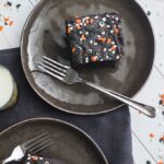 Two slices of spooky blackout chocolate buttermilk cake.