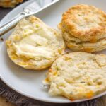 Rosemary cheddar buttermilk biscuits | Flaky, buttery layers, a perfect side for soup, chili, Thanksgiving, or any cozy meal. #thanksgivingsides #biscuits